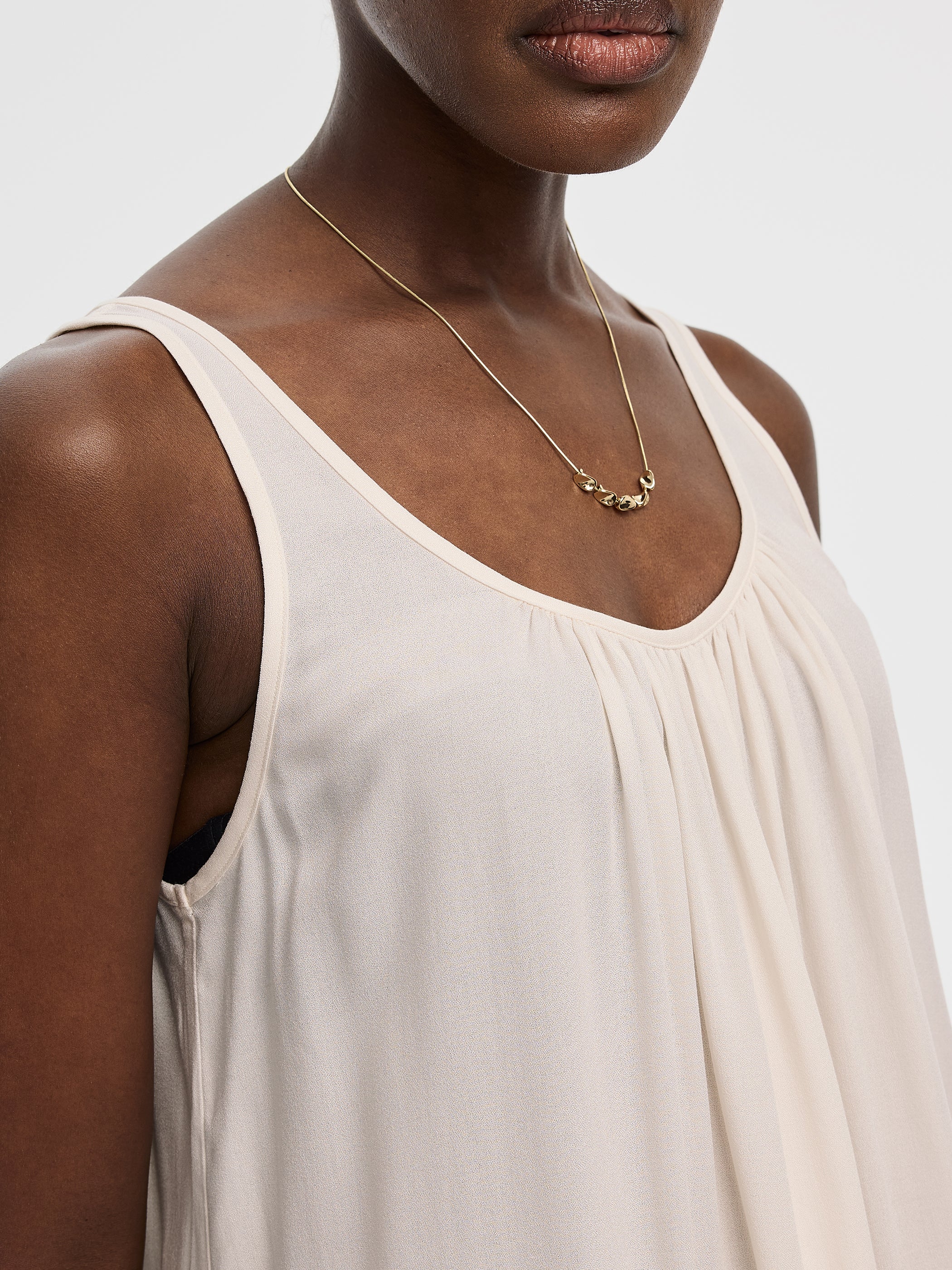 Scoop-Neck Tank with Asymmetrical Ruffled Hem