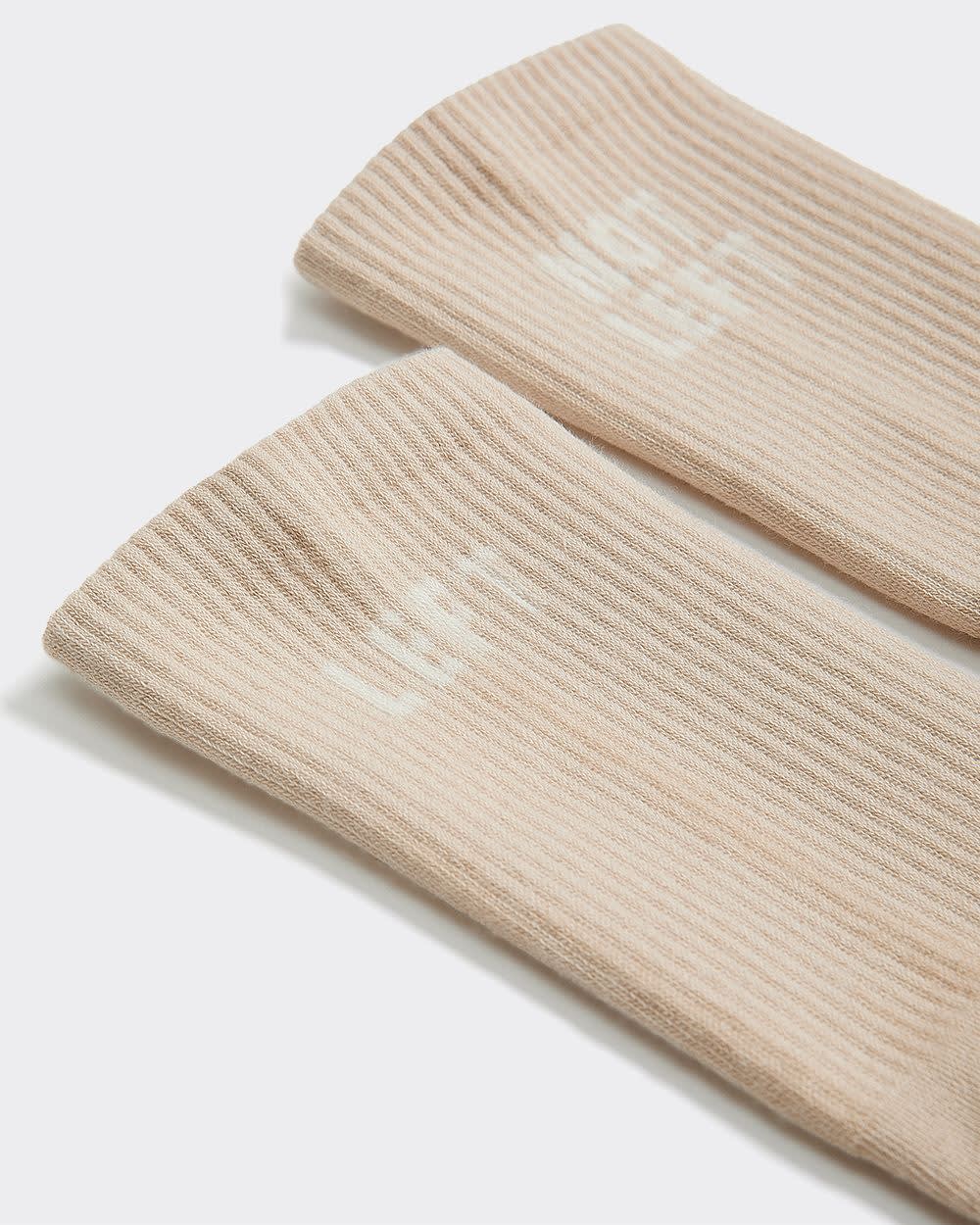 Bas côtelés avec « Left / Not Left » à l'ourlet