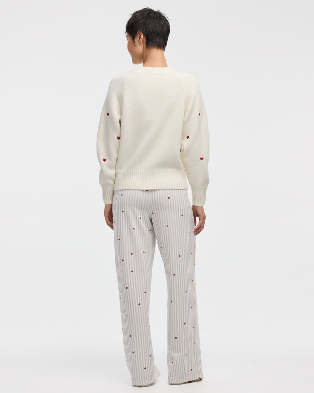 Pull à manches longues et col rond avec coeurs