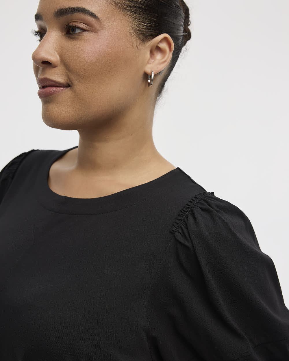 Haut à manches aux coudes bouffantes et col rond