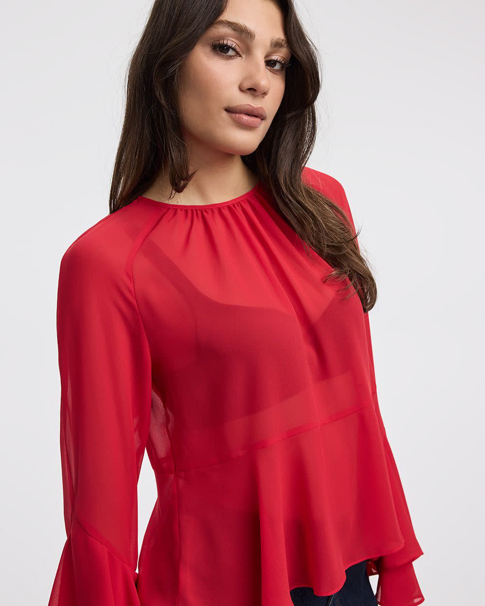 Blouse péplum à manches longues et col rond