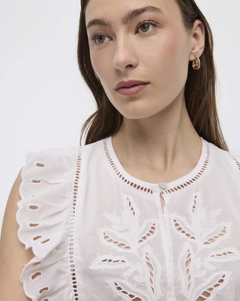 Blouse à col rond et manches très courtes avec broderies