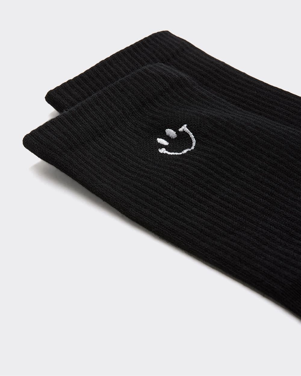 Bas côtelés avec bonhomme sourire à l'ourlet