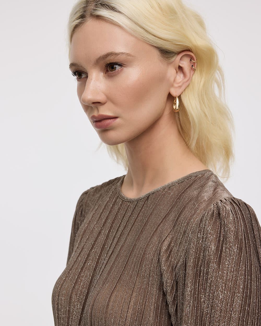 Blouse scintillante à manches longues et col rond