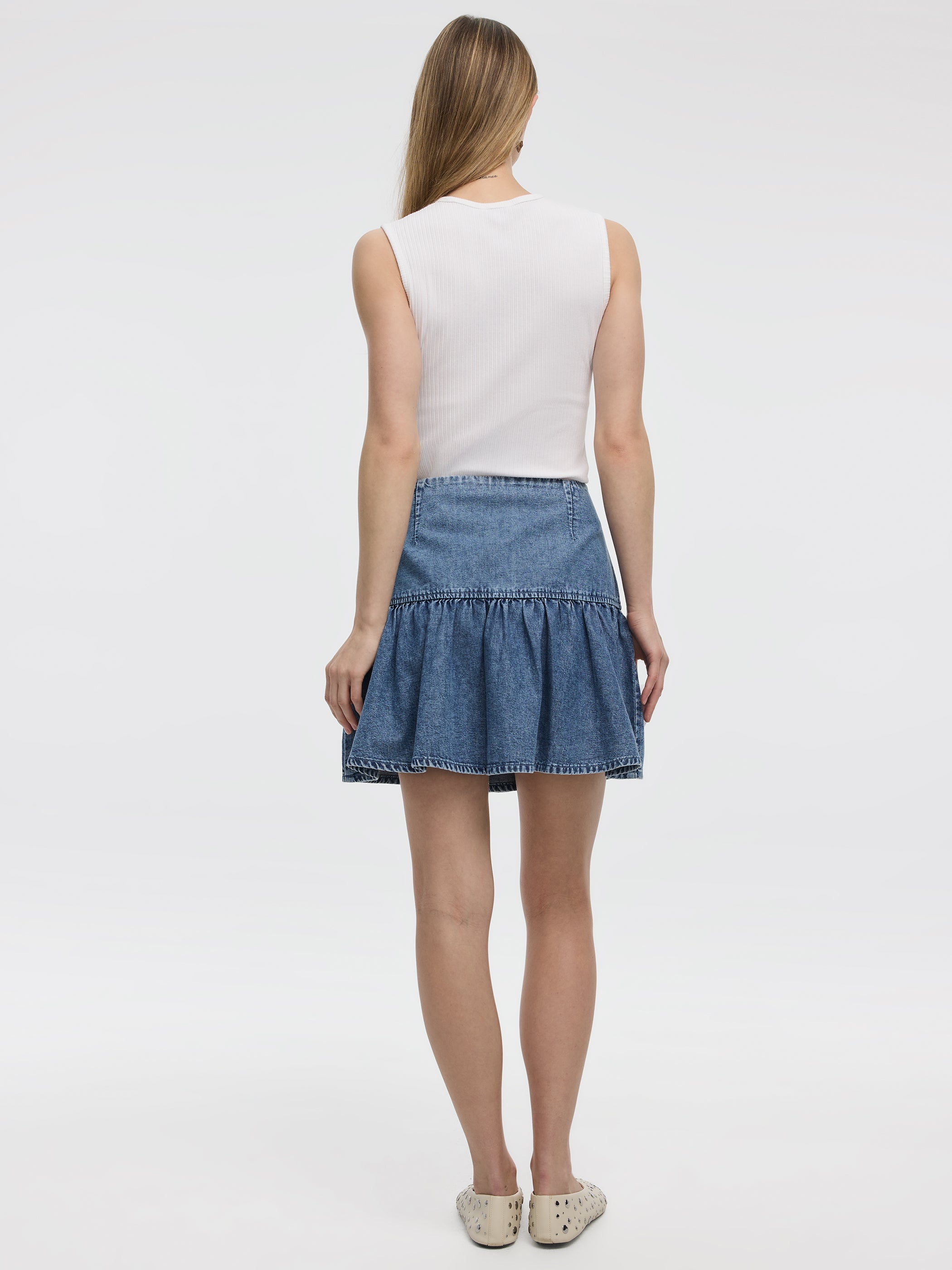 Mini-jupe en denim avec ourlet à volants