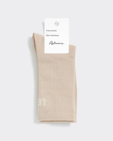 Bas côtelés avec « Left / Not Left » à l'ourlet