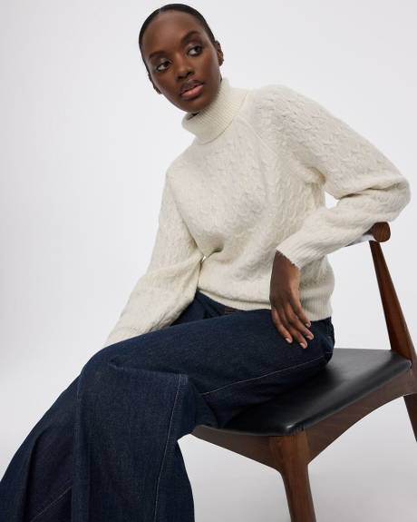 Pull &agrave; manches longues bouffantes et col montant