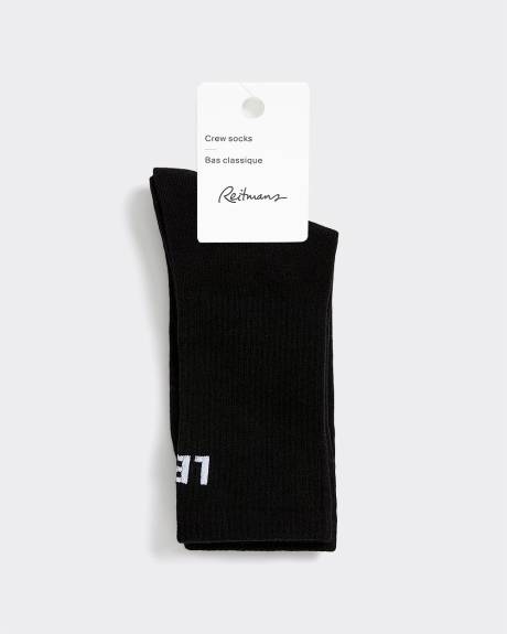 Bas côtelés avec « Left / Not Left » à l'ourlet