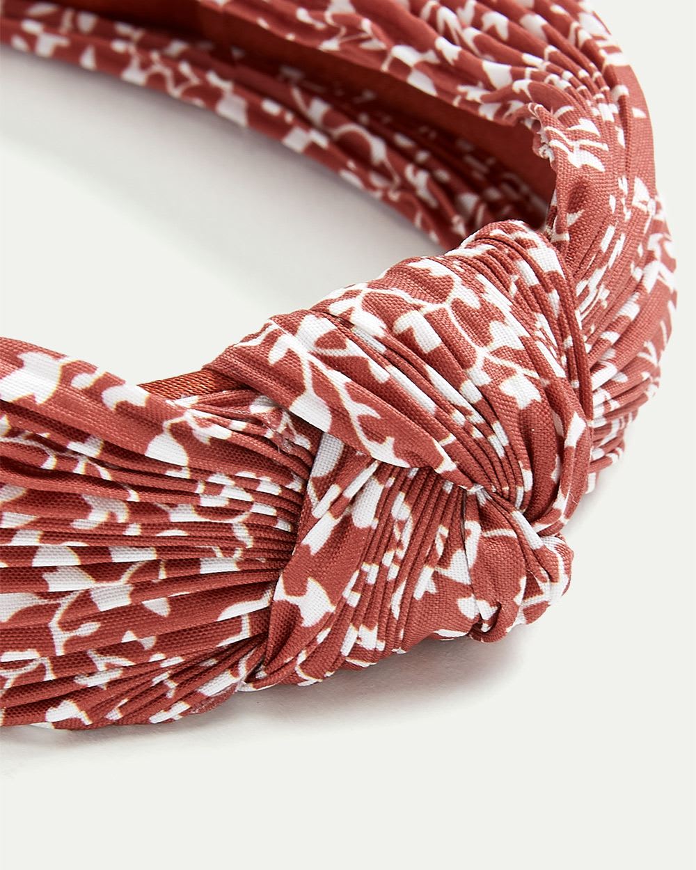 Serre-tête avec noeud imprimé à plis