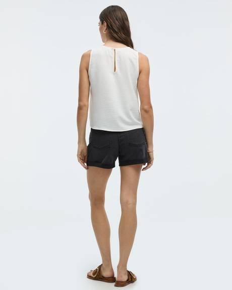 Blouse sans manches courtes avec boutons sur les côtés