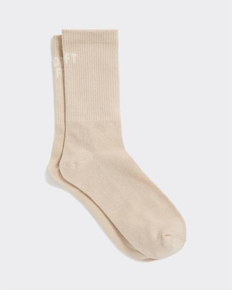 Bas côtelés avec « Left / Not Left » à l'ourlet