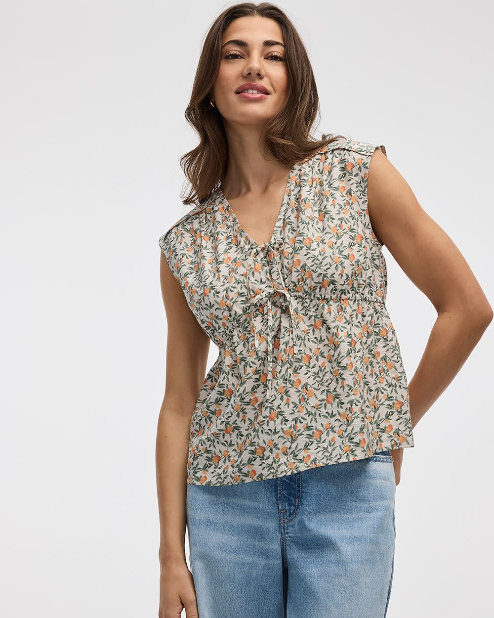 Sleeveless V-Neck Peplum Blouse