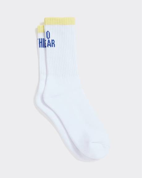 Bas côtelés avec citation à l'ourlet