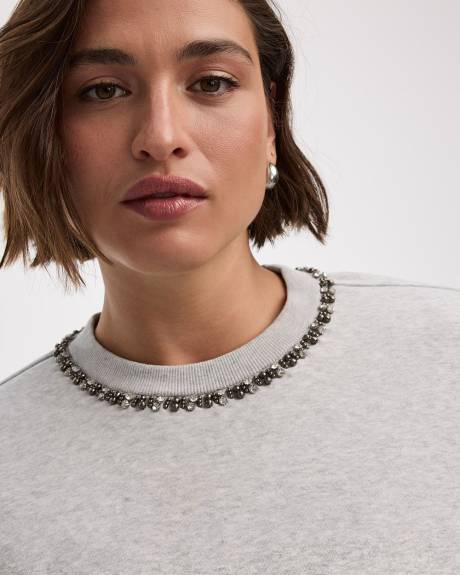 Pull en molleton à manches longues et col rond avec strass